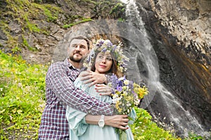 Young couple hipster hugging in nature