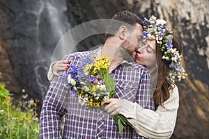 Young couple hipster hugging in nature