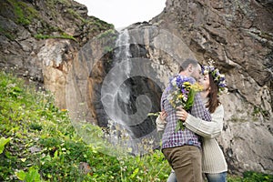 Young couple hipster hugging in nature