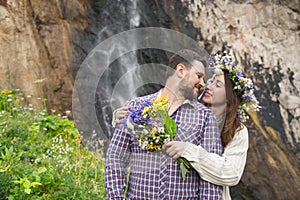 Young couple hipster hugging in nature