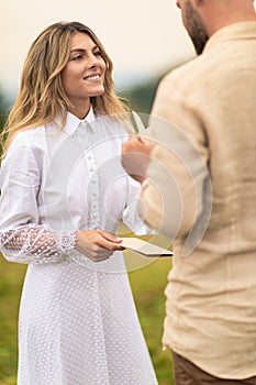 young couple holding hands and gazing deeply into each other's eyes as they exchange their heartfelt vows.