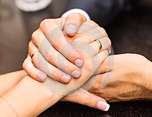 Young couple are holding hands