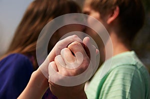 Young couple holding hands together