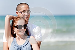 Young couple holding passionately at the beach