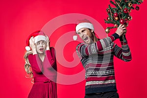 young couple holiday christmas decoration red background