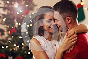 Young couple hugging in Christmas time