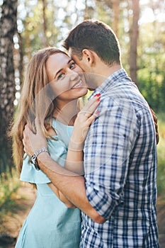 Young couple hugging on a date in the park