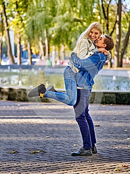 Young couple hugging and flirting in park