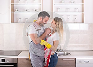 Young couple hugging after housework