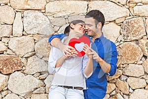 Young couple  Hugging, kissing and enjoying spending time together while celebrating Saint Valentine`s Day