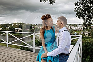 A young couple hugging on the observation deck.