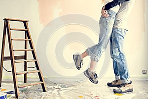 Young couple hugging in renovated house