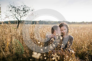 Young couple hugging at sunset