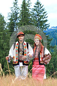 Young couple in hutsul costumes photo
