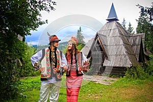 Young couple in hutsul costumes photo