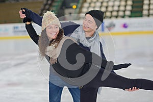 young couple ice skating