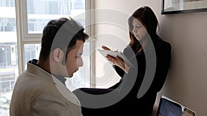 Young couple immersed in their tasks on a warking hour