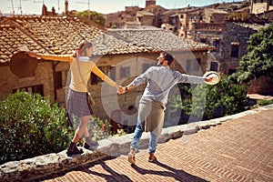 Young couple at the Italy - tourists couple visiting Toscana photo