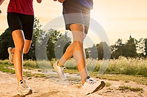 Young Couple Jogging in Park photo