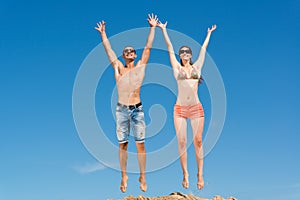 Young couple jumping together