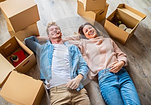 Young couple just moved into new apartment - Boyfriend and girlfriend moving in new home