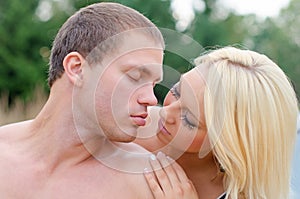 young couple kissing.