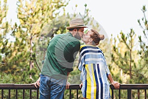 Young couple kissing on the balcony