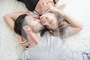 Young couple kissing in the bed .loving couple in bedroom.