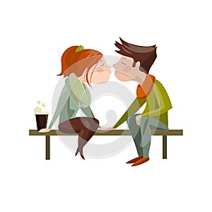 Young couple kissing on bench