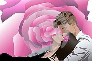 Young couple kissing each other while laying down. Rose flower on background