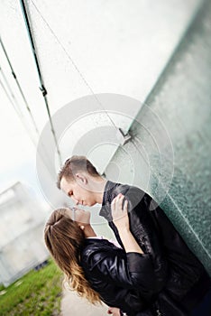 Young couple kissing. Engagement session.