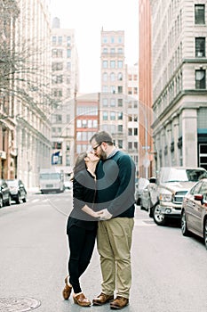 A young couple kissing on a NYC street