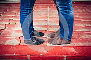 Young couple kissing outdoor foot