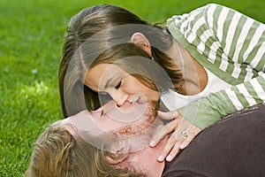 Young couple kissing in the Park