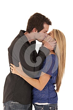 Young couple kissing side view