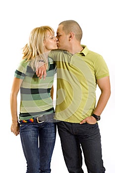 Young couple kissing, studio shot