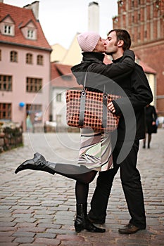 Young couple kissing in town