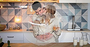 Young couple in kitchen before a Breakfast