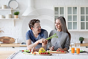 Young couple in the kitchen while preparing a vegetarian breakfast. Healthy eating