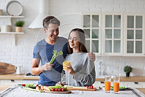 Young couple in the kitchen while preparing a vegetarian breakfast. Healthy eating