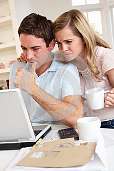 Young couple at a laptop computer