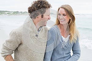 Young couple laughing at beach