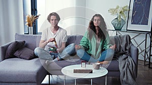 Young couple learning to care mental health. Family try meditation with tibetan bowl, standing bell. Meditation with