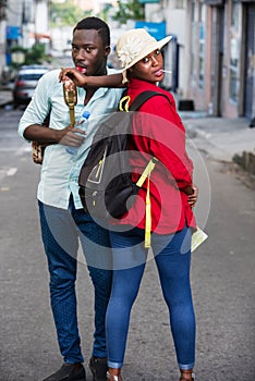 Young couple with lollipop candy