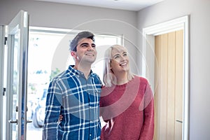 Young Couple Looking Around New Home To Rent Or Buy Together