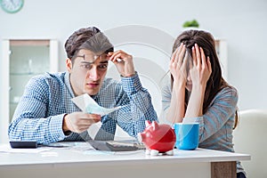 The young couple looking at family finance papers