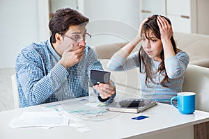 The young couple looking at family finance papers