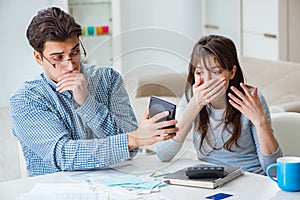 The young couple looking at family finance papers