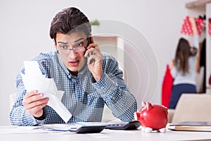 The young couple looking at family finance papers