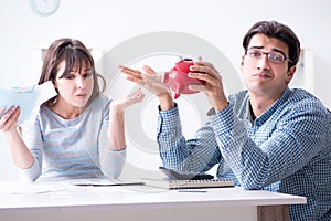 The young couple looking at family finance papers